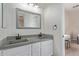 Bathroom featuring double sink vanity with gray countertop and modern black fixtures at 4615 E Calistoga Dr, Gilbert, AZ 85297