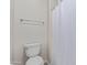 Bathroom featuring toilet, chrome towel bar, and a white shower curtain at 4615 E Calistoga Dr, Gilbert, AZ 85297