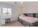Bedroom featuring bed with drawers, and a desk in front of the window for natural light at 4615 E Calistoga Dr, Gilbert, AZ 85297