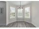 Bright breakfast nook with bay window and contemporary light fixture at 4615 E Calistoga Dr, Gilbert, AZ 85297