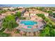 Aerial shot of a community pool with lounge chairs and pergola, nestled among residential homes at 4615 E Calistoga Dr, Gilbert, AZ 85297
