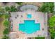 Overhead view of a community pool surrounded by trees, lounge chairs and shaded pergola seating at 4615 E Calistoga Dr, Gilbert, AZ 85297