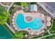 Aerial image of a stunning community pool, complete with a beach entry, splash pad and sun umbrellas at 4615 E Calistoga Dr, Gilbert, AZ 85297