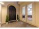 Warm and inviting entry featuring a dark door and glass french doors at 4615 E Calistoga Dr, Gilbert, AZ 85297