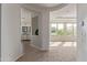 Inviting entryway with views to the open living area and bathroom vanity with neutral color palettes at 4615 E Calistoga Dr, Gilbert, AZ 85297