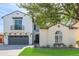 Charming two-story home with a well-kept lawn, balcony, gray garage doors and stucco exterior at 4615 E Calistoga Dr, Gilbert, AZ 85297