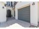 Charming home featuring an arched front door, a convenient attached garage, and balcony with decorative wrought iron at 4615 E Calistoga Dr, Gilbert, AZ 85297