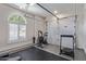 Bright garage featuring an exercise bike, treadmill, and natural light at 4615 E Calistoga Dr, Gilbert, AZ 85297