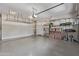 A spacious garage with ample storage space, shelving, and epoxy flooring at 4615 E Calistoga Dr, Gilbert, AZ 85297