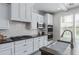 This kitchen features a gas cooktop, white subway tile backsplash, and stainless steel appliances at 4615 E Calistoga Dr, Gilbert, AZ 85297