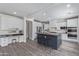Modern kitchen with a large island, sleek countertops, and ample cabinetry at 4615 E Calistoga Dr, Gilbert, AZ 85297