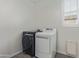 Bright laundry room features a front load washer, dryer, and window at 4615 E Calistoga Dr, Gilbert, AZ 85297