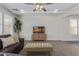 Cozy living room featuring coffered ceilings and a leather sofa at 4615 E Calistoga Dr, Gilbert, AZ 85297