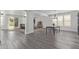 Bright open-concept living and dining area featuring gray wood floors and neutral paint at 4615 E Calistoga Dr, Gilbert, AZ 85297