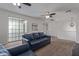 Cozy upstairs living room offering a comfortable seating area and a sliding glass door at 4615 E Calistoga Dr, Gilbert, AZ 85297