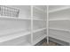 Large, well-organized walk-in pantry providing ample storage with white shelving at 4615 E Calistoga Dr, Gilbert, AZ 85297