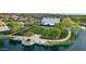 Scenic aerial view of a community pond featuring a charming event barn and landscaped walkways, perfect for outdoor enjoyment at 4615 E Calistoga Dr, Gilbert, AZ 85297
