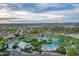 Aerial shot featuring a pond with a white event structure and pool area in a Primary-planned community at 4615 E Calistoga Dr, Gilbert, AZ 85297