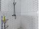 Close-up of walk-in shower showing tiling and shower fixture in updated and remodeled bathroom at 4615 E Calistoga Dr, Gilbert, AZ 85297
