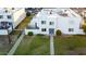 An aerial view showcases the townhome's layout with a well-maintained lawn and private fenced-in area at 5243 N 42Nd Ln, Phoenix, AZ 85019