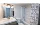 Bathroom featuring a shower-tub combo, new vanity, and contemporary fixtures at 5243 N 42Nd Ln, Phoenix, AZ 85019