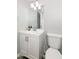 A bathroom with a stylish vanity, a sleek mirror, and neutral tones at 5243 N 42Nd Ln, Phoenix, AZ 85019