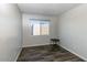 Simple bedroom with wood floors and a window overlooking the neighborhood at 5243 N 42Nd Ln, Phoenix, AZ 85019