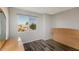Bright bedroom with a large window and wood floors, creating a cozy atmosphere at 5243 N 42Nd Ln, Phoenix, AZ 85019