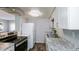 Kitchen featuring white cabinets, stainless steel appliances, and granite countertops at 5243 N 42Nd Ln, Phoenix, AZ 85019