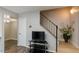 Living room featuring wood floors, modern furniture, and a staircase leading to the upper level at 5243 N 42Nd Ln, Phoenix, AZ 85019