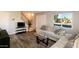 Inviting living room with modern decor, laminate flooring, and lots of natural light at 5243 N 42Nd Ln, Phoenix, AZ 85019