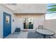 Cozy patio area featuring a table, chairs, and convenient access to the interior through a sliding glass door at 5243 N 42Nd Ln, Phoenix, AZ 85019