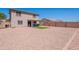 Large backyard with patio area and artificial turf, providing ample space for outdoor activities at 10417 W Pioneer St, Tolleson, AZ 85353