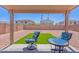 Charming backyard patio with artificial turf, perfect for relaxing and enjoying outdoor living at 10417 W Pioneer St, Tolleson, AZ 85353