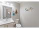 Charming powder room with mermaid themed accents and a stylish sink at 10417 W Pioneer St, Tolleson, AZ 85353