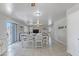 Inviting dining area featuring a large table with a view to both the living room and backyard at 10417 W Pioneer St, Tolleson, AZ 85353