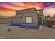 Charming two-story home featuring a desert-friendly landscape and attached two-car garage at 10417 W Pioneer St, Tolleson, AZ 85353