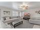 Cozy living room with comfortable seating and a bright window, perfect for relaxing at 10417 W Pioneer St, Tolleson, AZ 85353