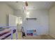 Bedroom featuring bunk beds, ceiling fan, neutral walls, and walk-in closet at 11060 E Sorpresa Ave, Mesa, AZ 85212