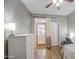 Bedroom featuring wood-look flooring, ceiling fan, closet, and white dresser at 11060 E Sorpresa Ave, Mesa, AZ 85212