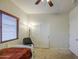 Bedroom showcasing standard closet, neutral walls, and a ceiling fan at 11060 E Sorpresa Ave, Mesa, AZ 85212
