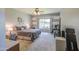 Comfortable bedroom featuring neutral tones, a ceiling fan, and a large window offering natural light at 11060 E Sorpresa Ave, Mesa, AZ 85212