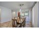 Dining room with tile flooring, modern light fixture, and view into the kitchen at 11060 E Sorpresa Ave, Mesa, AZ 85212