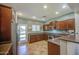 Stylish kitchen with stainless steel appliances, ceramic tile flooring, and a convenient door to the backyard at 11060 E Sorpresa Ave, Mesa, AZ 85212