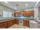 Modern kitchen with stainless steel oven, ample counter space, and well-maintained wooden cabinets at 11060 E Sorpresa Ave, Mesa, AZ 85212