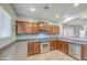 A kitchen featuring stainless steel dishwasher and stove, plenty of countertop space, and wooden cabinets at 11060 E Sorpresa Ave, Mesa, AZ 85212