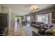 Cozy living room with tile flooring, neutral walls, and comfortable seating area at 11060 E Sorpresa Ave, Mesa, AZ 85212