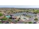 Aerial view of community recreation area showcasing tennis courts, pool, and bocce ball at 11250 E Kilarea Ave # 276, Mesa, AZ 85209