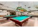 Billiard room with multiple tables and vintage lighting offering a classic recreational experience at 11250 E Kilarea Ave # 276, Mesa, AZ 85209