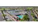 Aerial view of community amenities including pool, tennis courts, bocce ball, and shuffleboard at 11250 E Kilarea Ave # 276, Mesa, AZ 85209